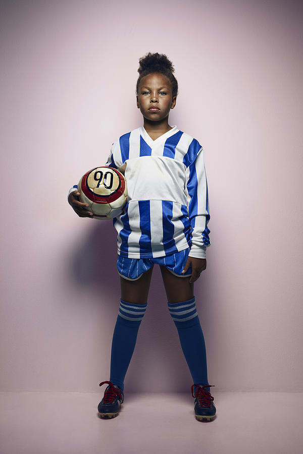 Portrait of cool young female football player #1 Photograph by Klaus Vedfelt