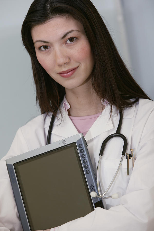 Portrait of doctor with tablet pc #1 Photograph by Comstock Images