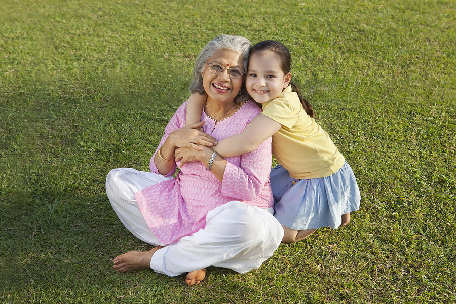 Portrait of grandmother and granddaughter smiling #1 Photograph by Ravi Ranjan