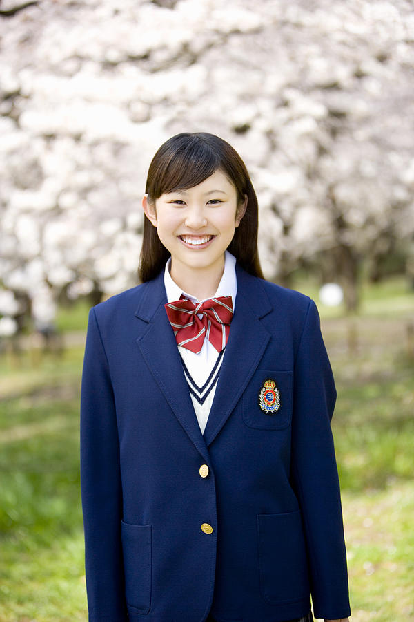 Portrait of high school girl with cherry blossoms in the background #1 Photograph by Daj