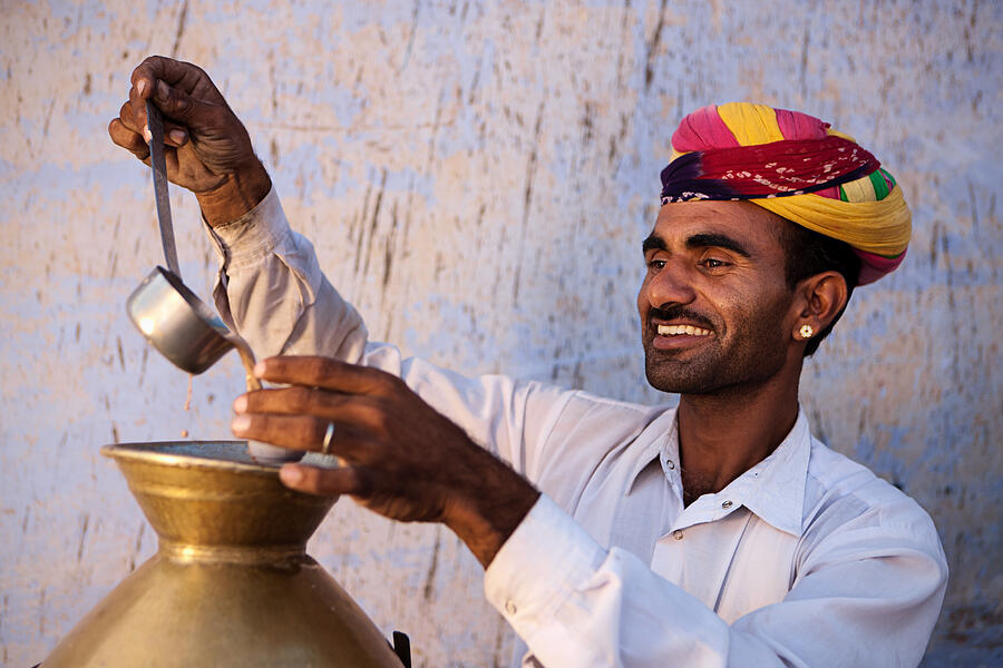 Portrait of Indian street seller selling tea - masala chai #1 Photograph by Hadynyah