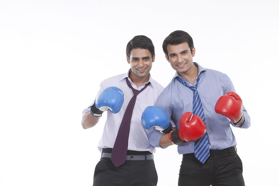 Portrait of two male executives with boxing gloves #1 Photograph by IndiaPix/IndiaPicture