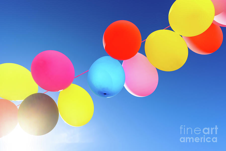 Pretty Sunlit Solid Color Balloons Viewed From Below With Blue S