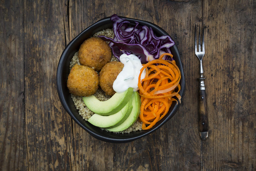 Quinoa lunch bowl with sweet potato falafel, carrots, red cabbage, avocado and yoghurt sauce #1 Photograph by Larissa Veronesi
