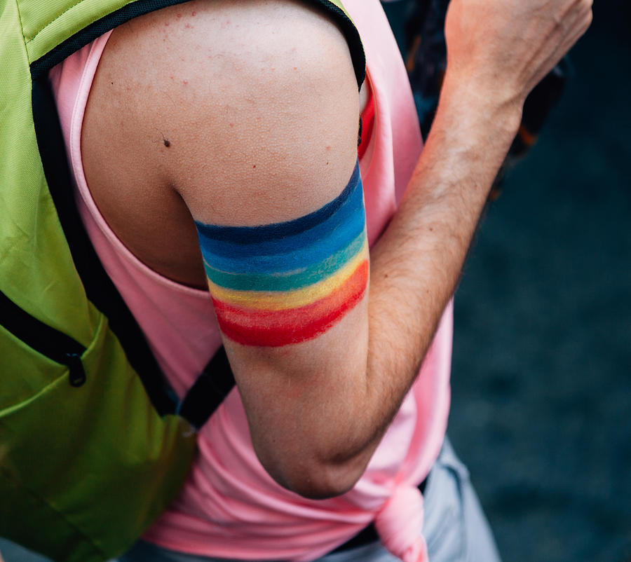 Rainbow flag sign on arm #1 Photograph by Serts