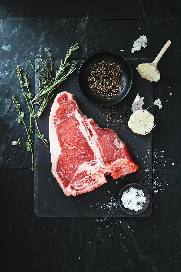 Raw t-bone steak #1 Photograph by Eugene Mymrin