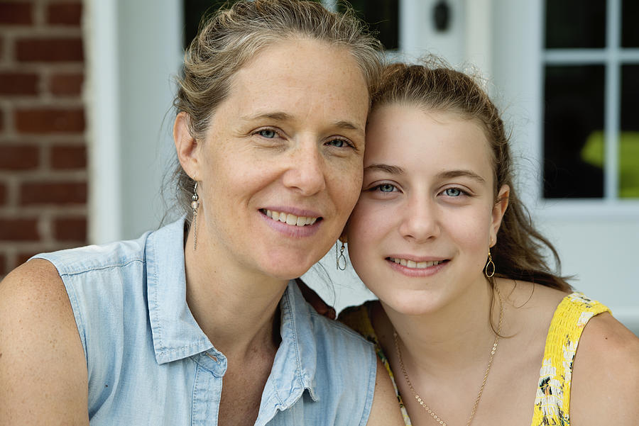 Real family portrait of mother and teenage daughter on home porch in summer. #1 Photograph by Martinedoucet