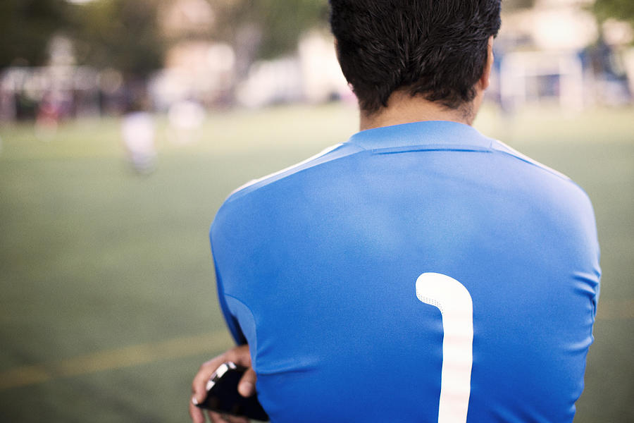 Rear view of soccer player standing at field #1 Photograph by Cavan Images