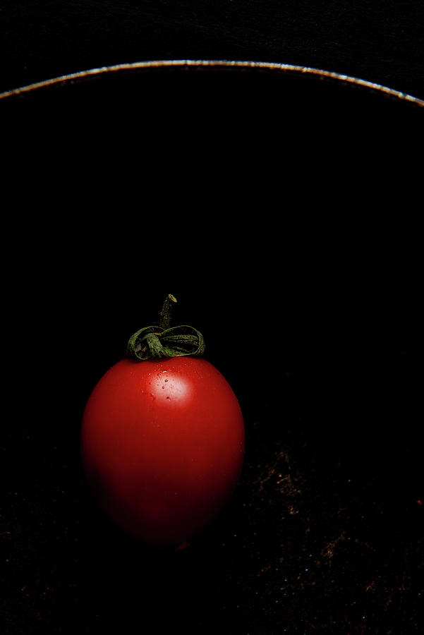 Red Fresh Healthy Tomato Isolated On A Black Pan Photograph