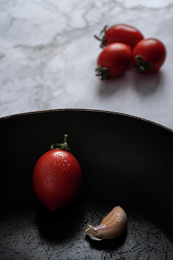 Red Fresh Healthy Tomatoes And Spicy Garlic Photograph