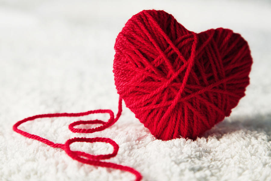 Red heart-shaped wool ball unraveling #1 Photograph by Andrew Bret Wallis