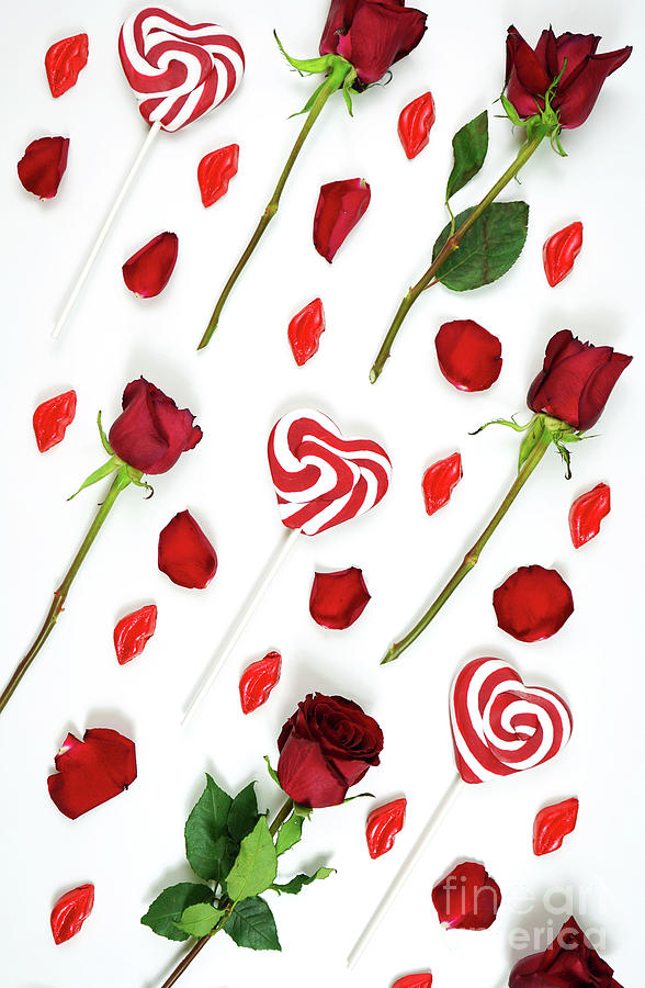 Red roses, petals, lollipops and chocolates creative composition layout. #1 Photograph by Milleflore Images
