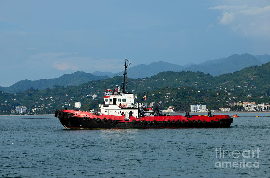 Transportation Photograph - Red tug boat at sea with mountain background traveling in Black Sea Batumi harbor Georgia #2 by Imran Ahmed