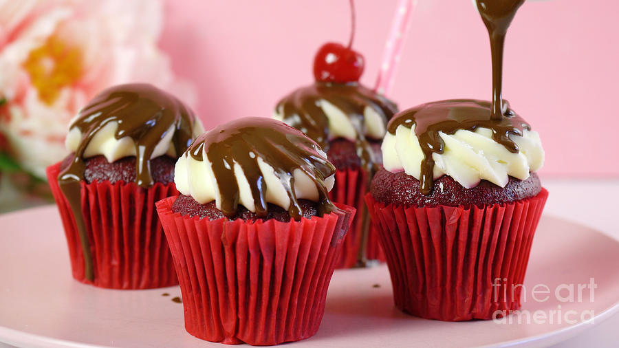 Red velvet cupcakes with chocolate sauce and cherries. #1 Photograph by Milleflore Images