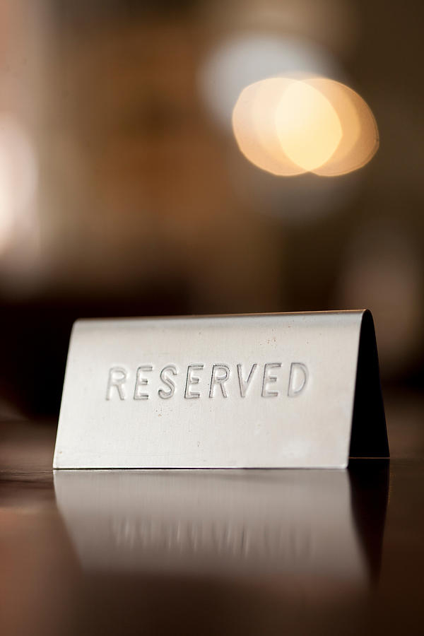 Reserved notice on restaurant table #1 Photograph by Zero Creatives