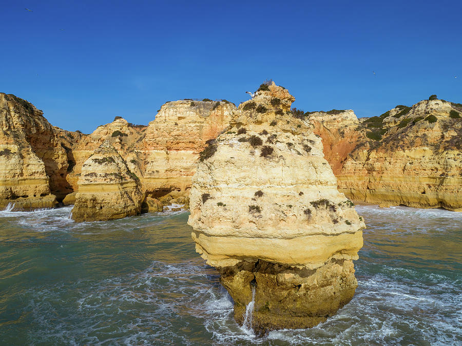 Rock cliffs and waves in Algarve #1 Photograph by Mikhail Kokhanchikov