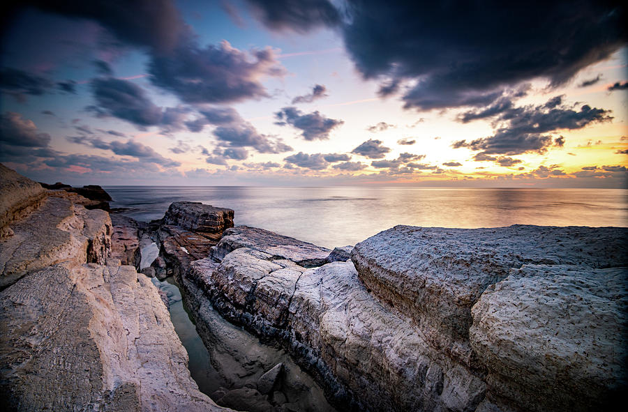 Rocky seashore seascape with dramatic and beautiful sunset at se #1 Photograph by Michalakis Ppalis