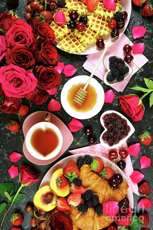 Romantic indulgent breakfast with croissants, pancakes, waffles fruit and roses. #1 Photograph by Milleflore Images
