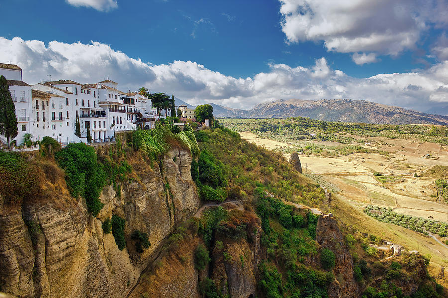 Ronda, Spain - Wide angle view of famous Ronda village situated solely on mountaintop against dramatic clouds #2 Photograph by Arpan Bhatia
