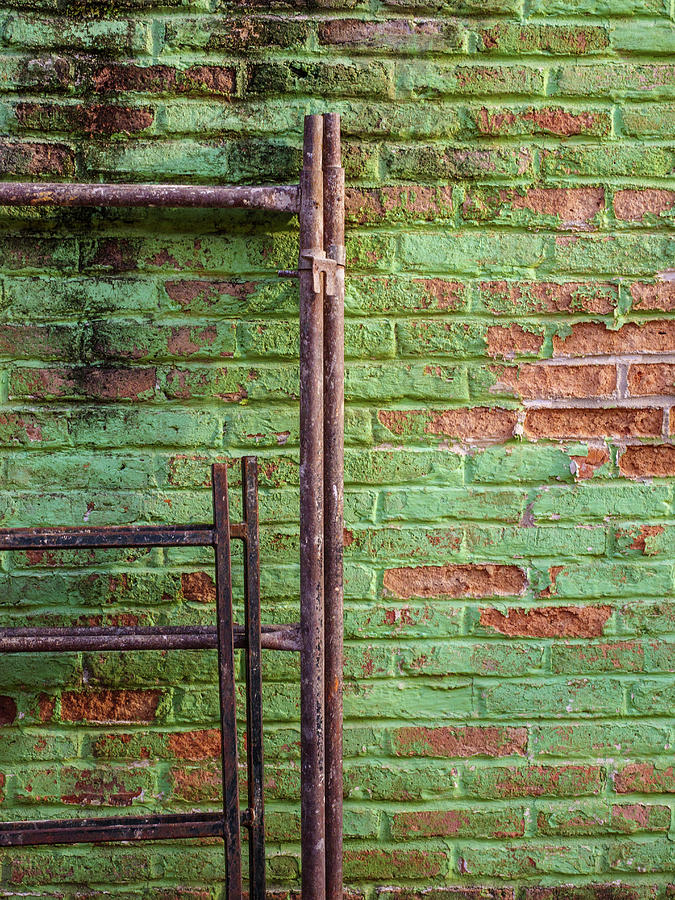Scaffolding against green wall. #1 Photograph by Rob Huntley