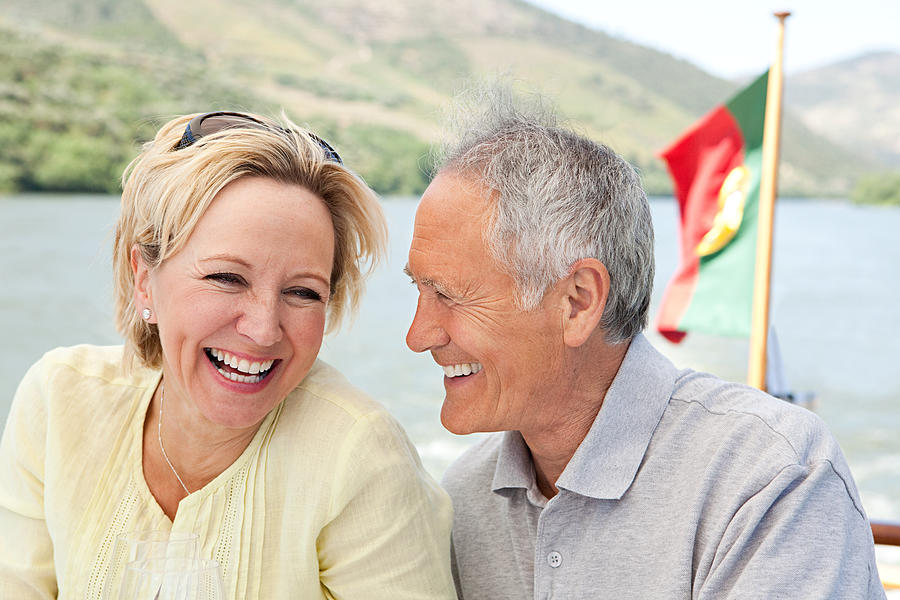 Senior couple on holiday on boat #1 Photograph by Image Source