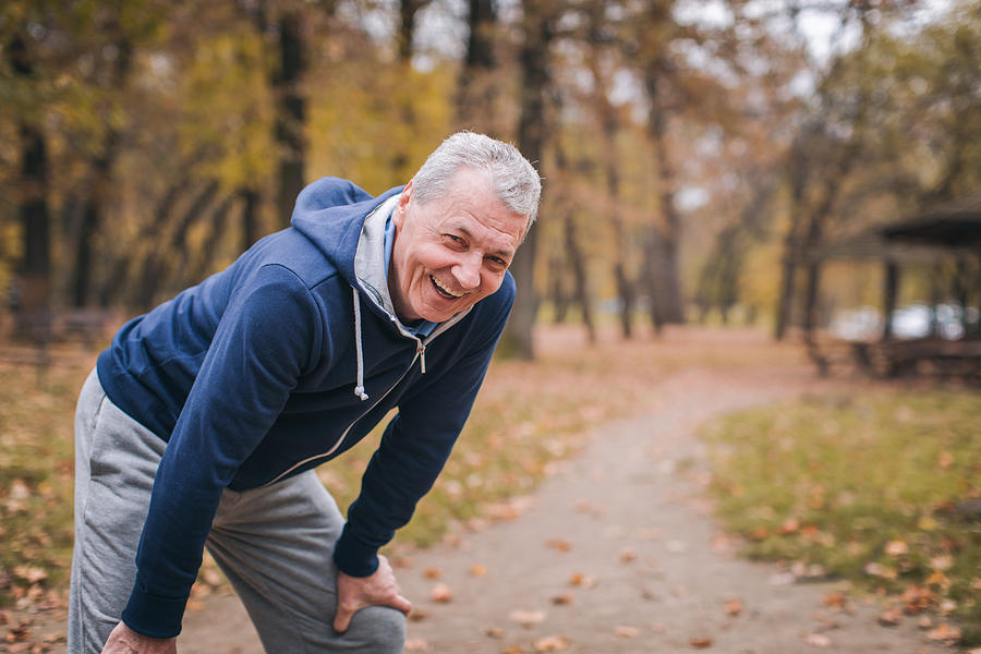 Senior man exercizing outdoors #1 Photograph by Supersizer
