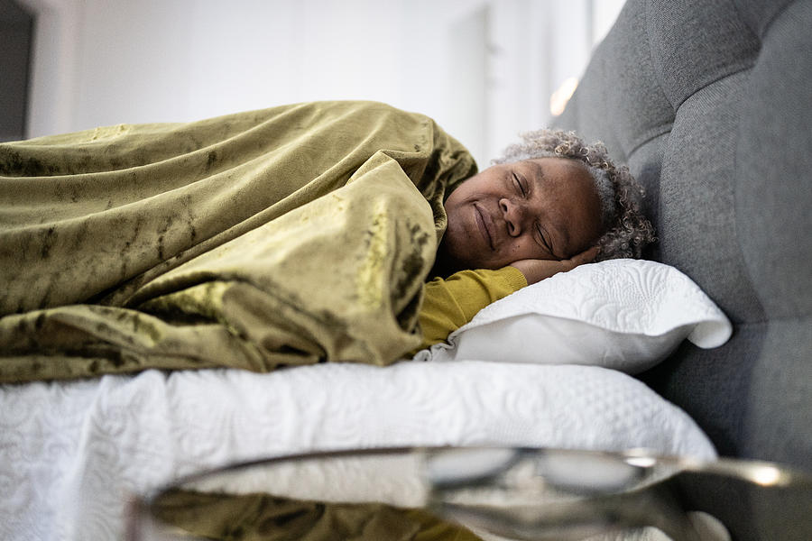 Senior woman sleeping at home #1 Photograph by FG Trade