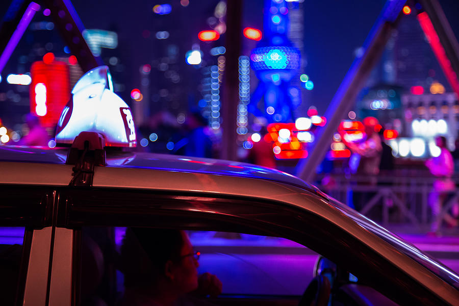 Shanghai taxi at night in the streets of the city. #1 Photograph by Artur Debat