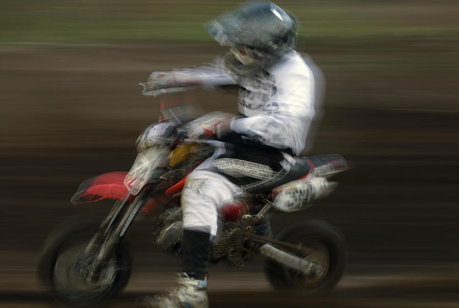 Side profile of a man riding a motorcycle in a sports race #1 Photograph by Glowimages