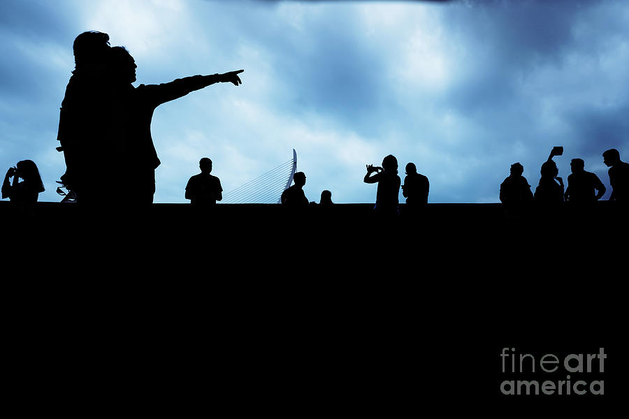 Silhouette of unrecognizable people pointing with a dark background. #1 Photograph by Joaquin Corbalan