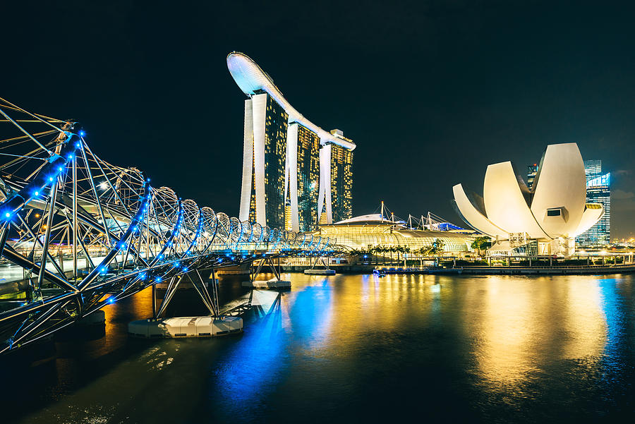 Singapore Skyline reflecting in water #1 Photograph by Nikada