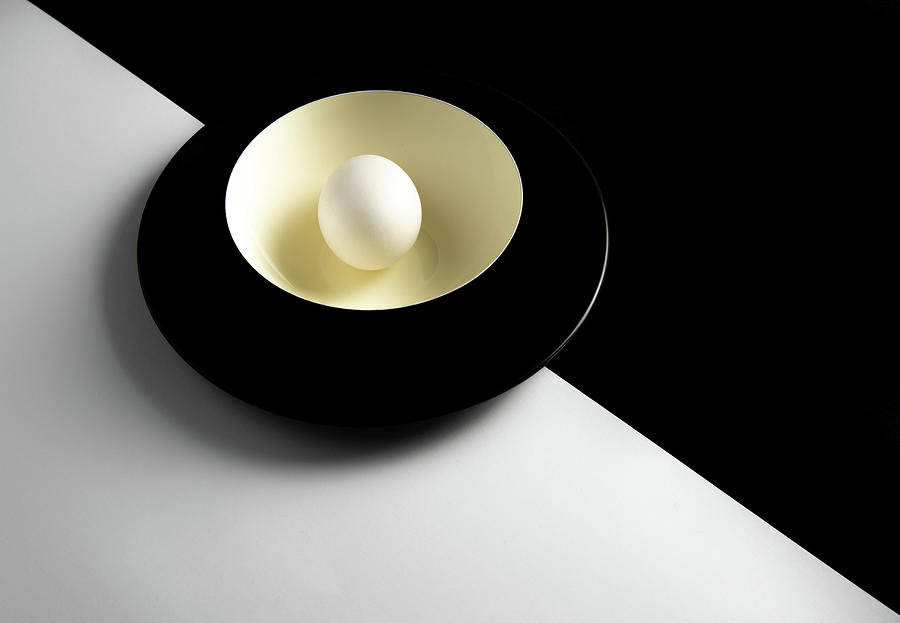 Single fresh white egg on a yellow bowl Photograph by Michalakis Ppalis