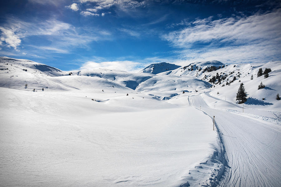 Ski slope on snow covered landscape, Arosa, Swiss Alps, Switzerland #1 Photograph by Francesco Meroni