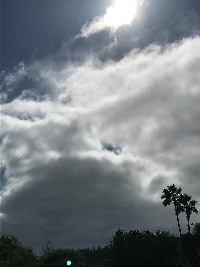 Changing clouds in the sky Photograph by Isabelle Foley - Fine Art America