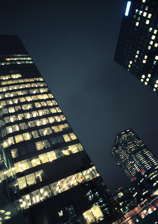 Skyscrapers at night, low angle view Photograph by Frederic Cirou Skyscrapers at night, low angle view Photograph by Frederic Cirou