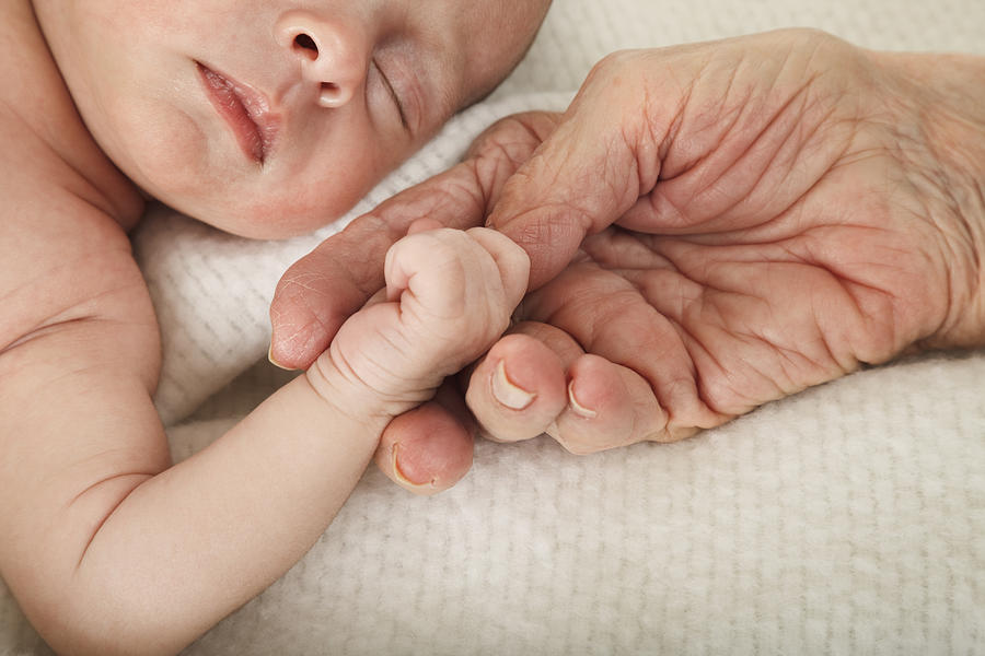 Sleeping Baby Holding Great Grandmothers Hand #1 Photograph by Dszc