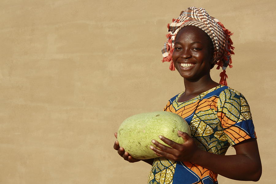 Smiling woman with watermelon #1 Photograph by Commerceandculturestock
