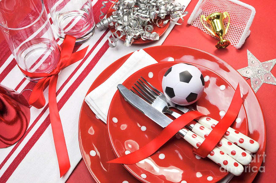 Soccer football celebration party table settings in red and whit #1 Photograph by Milleflore Images
