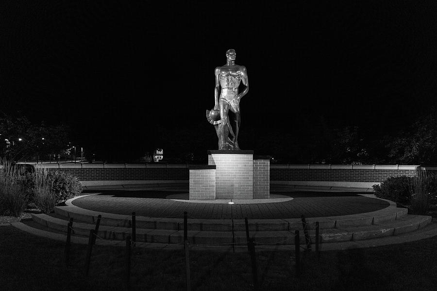 Spartan statue at night on the campus of Michigan State University in East Lansing Michigan #1 Photograph by Eldon McGraw