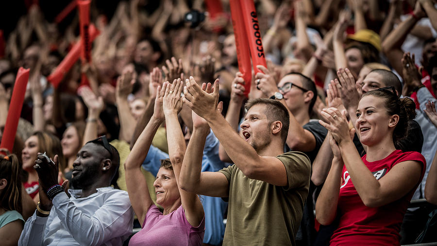 Spectators cheering in stadium #1 Photograph by Simonkr