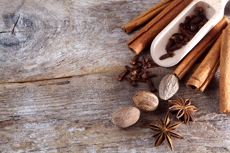 Spices on wooden background. #1 Photograph by Nambitomo