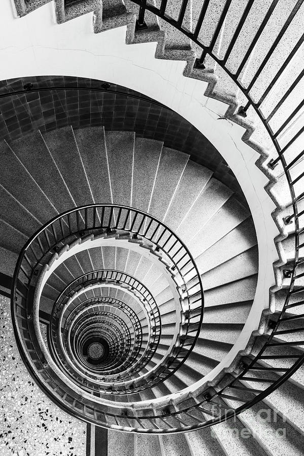 Black And White Photograph - Spiral staircase in The Neboticnik, Ljubljana, Slovenia #1 by Neale And Judith Clark