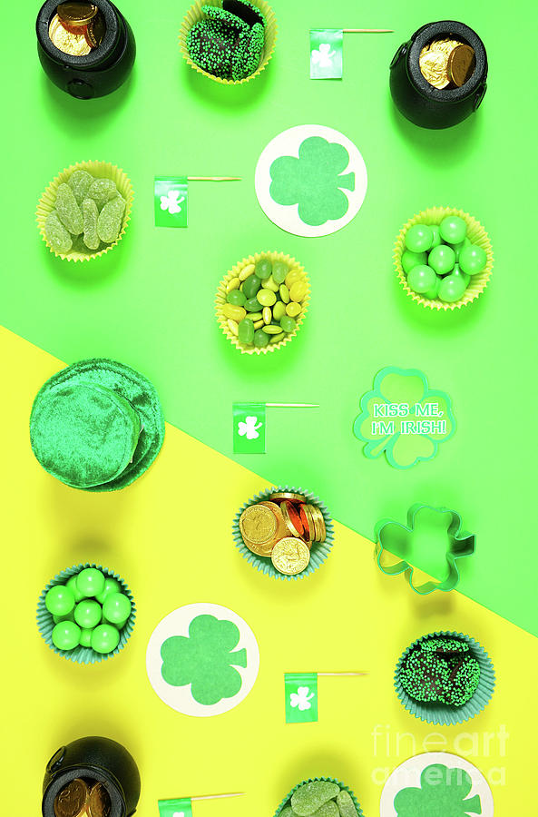 St Patricks Day flat lay with chocolate coins, leprechaun hat and shamrocks. #1 Photograph by Milleflore Images