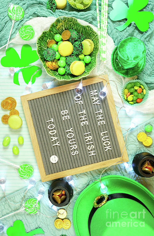 St Patricks Day flatlay with leprechaun hat, chocolate coins, and letter board. #1 Photograph by Milleflore Images