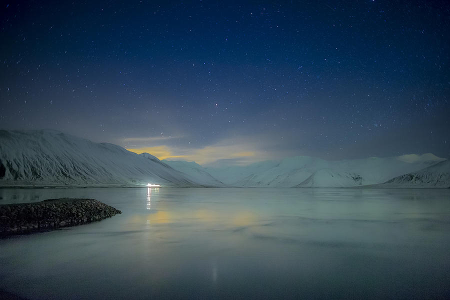 Starry night over snow covered landscape #1 Photograph by Arctic-Images