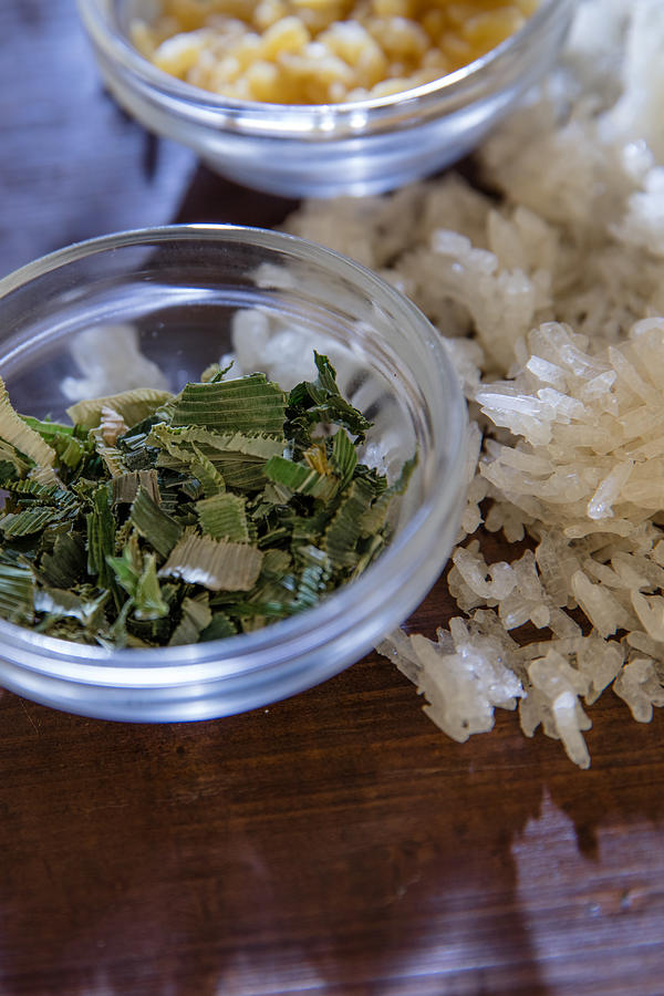 Sticky rice, pandanus leaves and mung beans. #1 Photograph by Annick Vanderschelden Photography