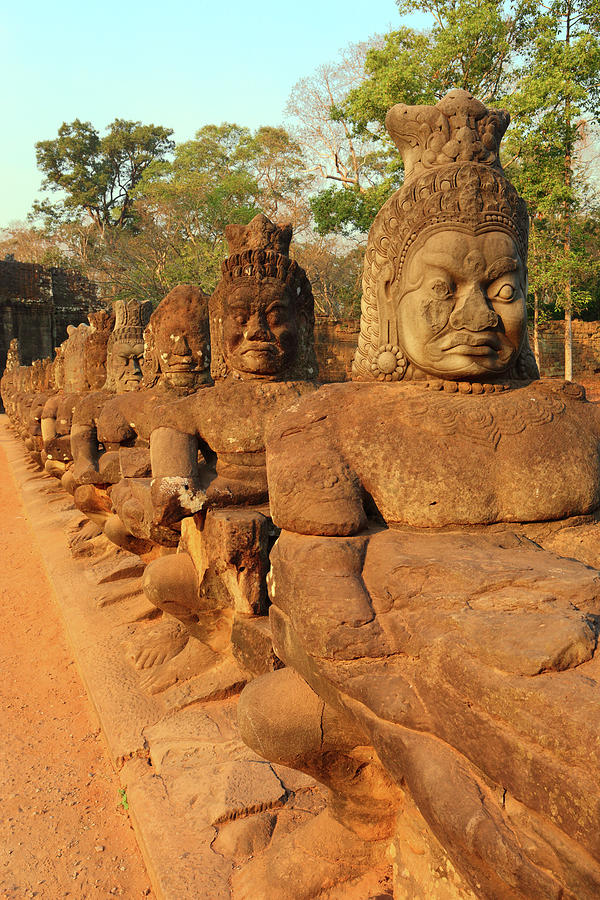 Stone carved statues of Devas in Cambodia #1 Photograph by Mikhail Kokhanchikov