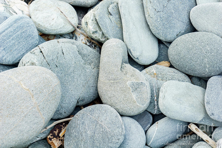 Stone in range of colors and patterns on beach. Photograph by Brian ...