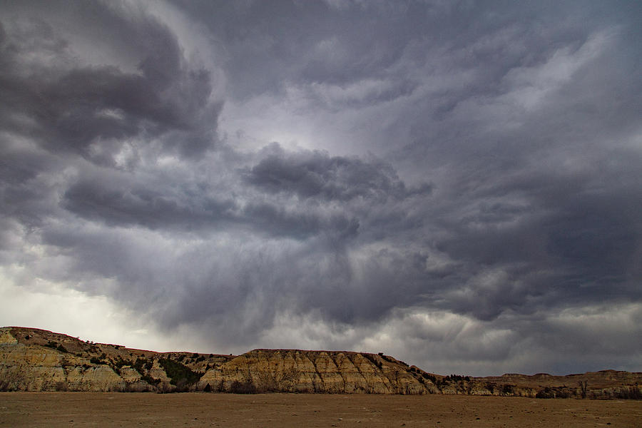 Storm clouds over mountain at Theodore Roosevelt National Park in North Dakota #1 Photograph by Eldon McGraw