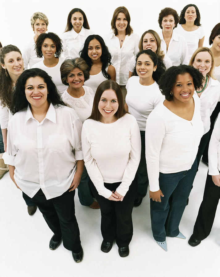 Studio Portrait of a Mixed Age, Multiethnic, Large Group of Happy Women Wearing White Tops #1 Photograph by Digital Vision.